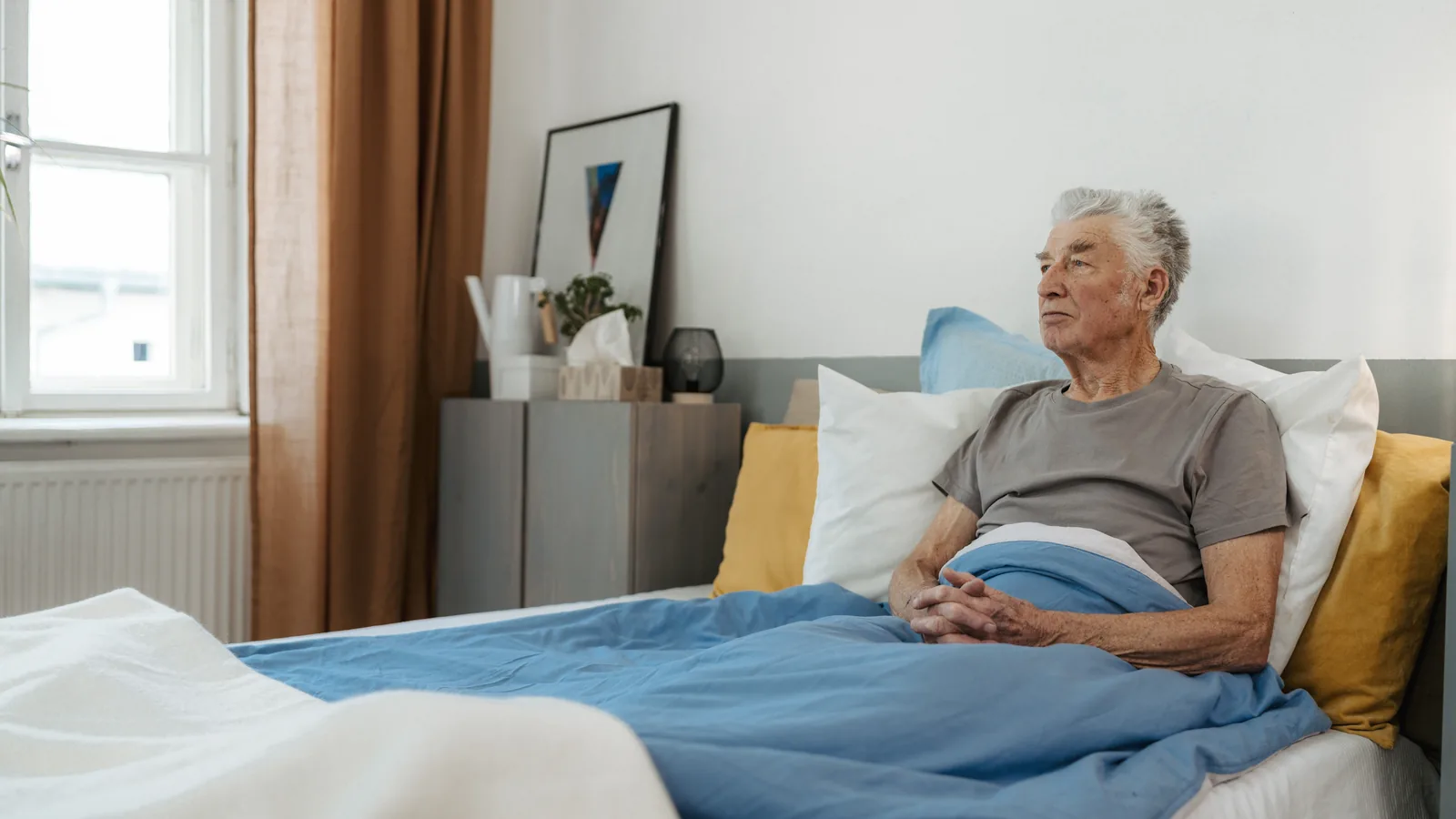 Pressure-relief mattress on a patient's bed for home care support.
