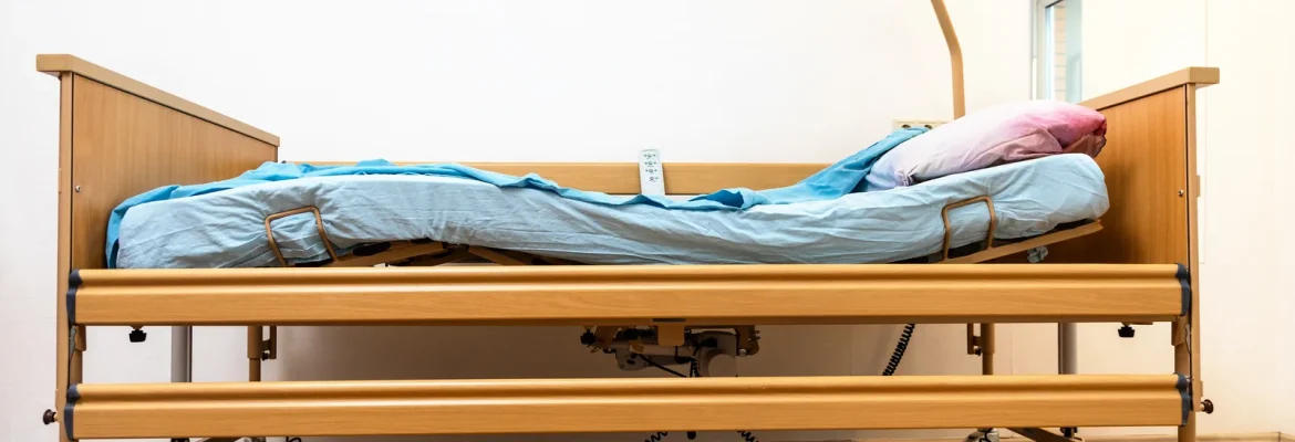 Electric home care bed in a house bedroom for patient care.