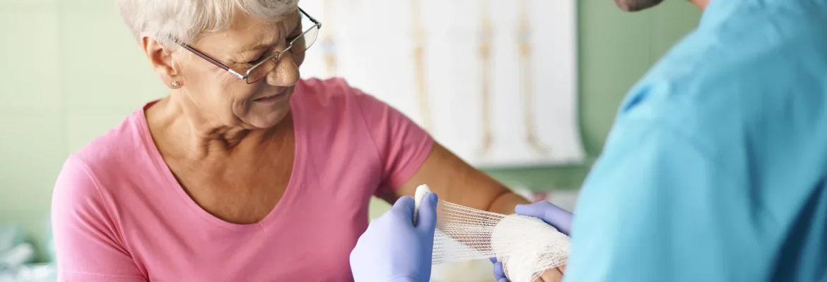 Nursing wound care at home with clean dressings and materials.